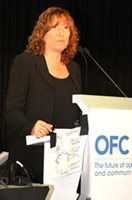 Eve Griliches speaks at a panel at OFC 2014.